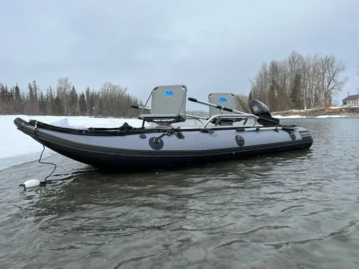 Raft rigged with a custom frame, two seats and a motor mount
